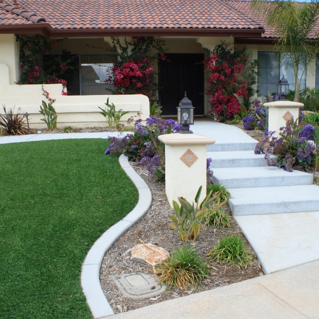 Artificial turf front yard installation by Elite Hardscape Inc.